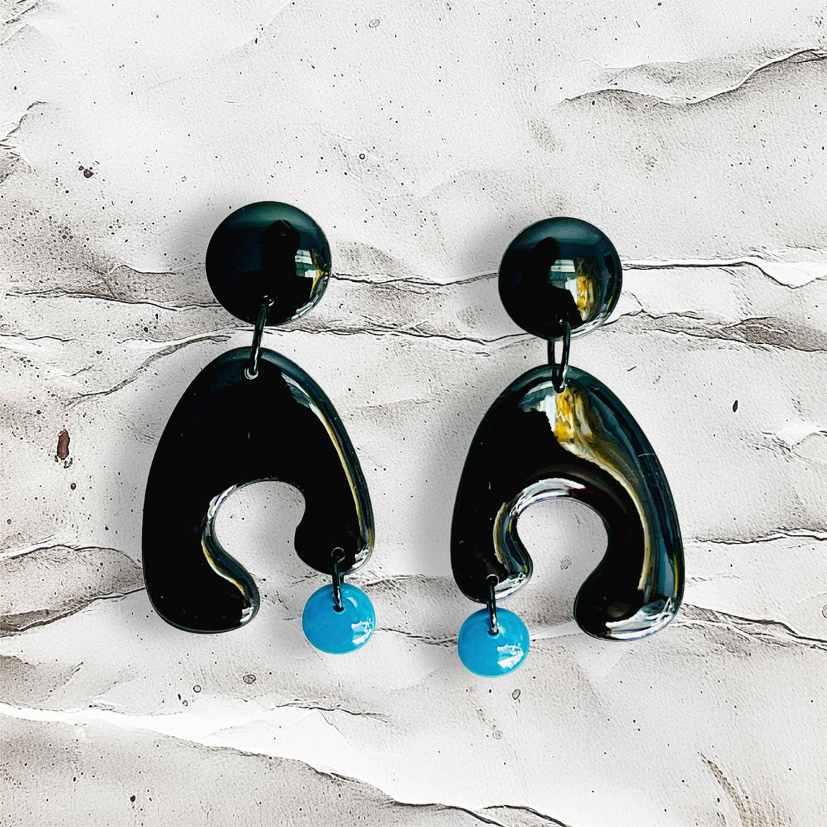 Unique shape earring- Boomerang ( little drop from cave )